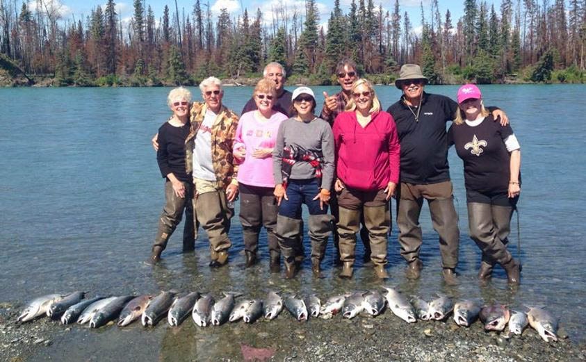Group of fishermen on the Kenai River with their catch
